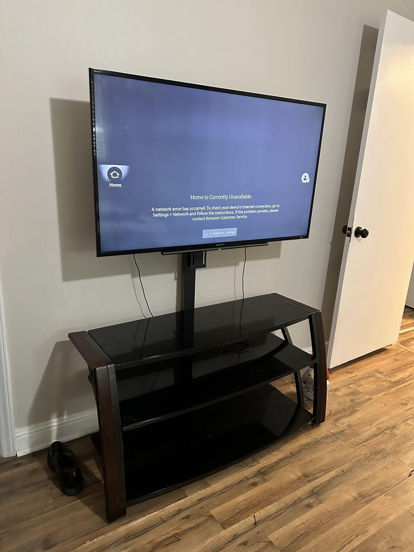 TV stand, 55” Bravía TV And Speakers Included