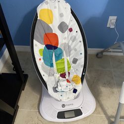 Mama Roo multi-motion baby swing.