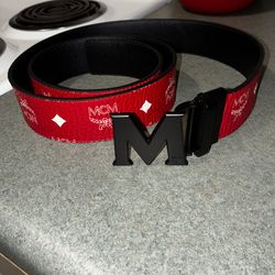 Men’s red Mcm belt with matte black buckle