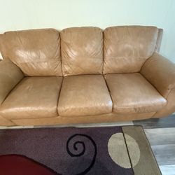 A Pair Of Leather Sofas