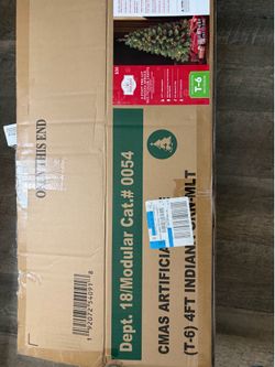 This is a Holiday Time 4-foot pre-lit Indiana Spruce artificial Christmas tree in multicolor.The tree features 173 branch tips and is lit with 105 mul