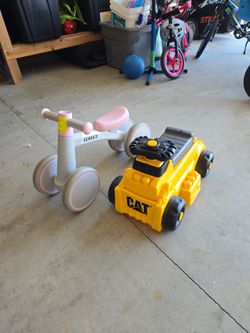 Baby balance bike and cat toy