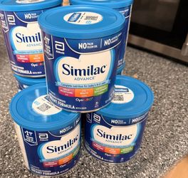 New unopened cans of baby formula