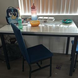 Marble Table With 4 Blue Chairs