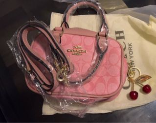 Women’s mini Coach bag. Pink Signature Logo Canvas with Cherry Charm