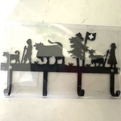 Swiss Silhouette Black Metal Key / Hook / Rack Holder   Decorative black metal key holder smaller item rack. Has a cute Swiss-themed silhouette design