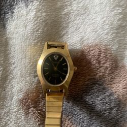 Armitron gold tone with black dial womens watch on stretch bracelet