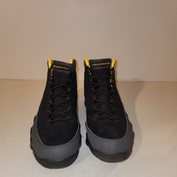 9 Retro "Dark Charcoal University Gold" sneakers.  