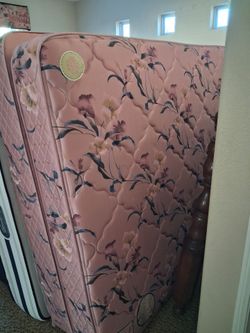 Queen-sized mattress, box springs, and mattress topper