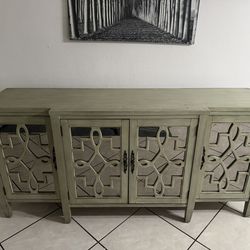 Antique finish console cabinet with mirrored door