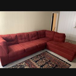 Red Living Spaces Couch w/Right Chaise $250 Pick Up Only