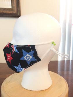 Handmade mask 100% cotton. has adjustable buckle for ears and strip nose bridge wire. Comes in addition a compartiment for filter.