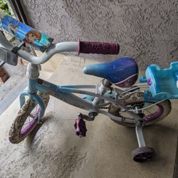 Girl Frozen Bike With Helmet.