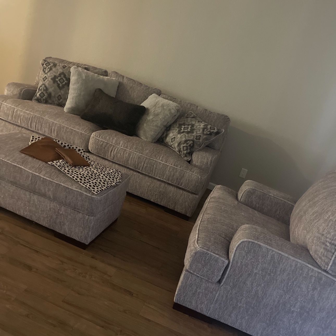 Gray sofa w/ over sized chair and ottoman