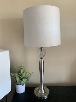 Silver table lamp with off white / cream linen shade