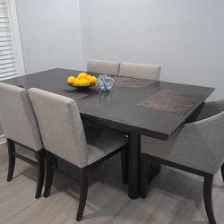 Dark beautiful  dinning table with Five Chairs.