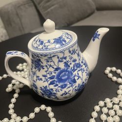 Beautiful blue and white teapot. Has a lovely floral design. Great for serving tea or as a decorative item.