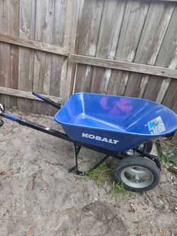 Blue Kobalt wheelbarrow in good condition. $90 Located Mount Dora Fla 32757
