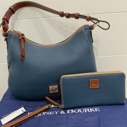 Authentic Dooney & Bourke Pebble Grain Shoulder Bag with matching wallet.  Color is Jeans.  Zipper closure. 