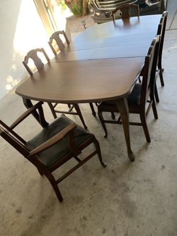 Vintage original oak wood dining table with six top leather chairs