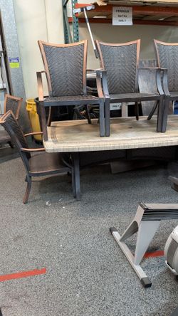 Six piece outdoor dining set.. table and five chairs. Aluminum. Never rust.
