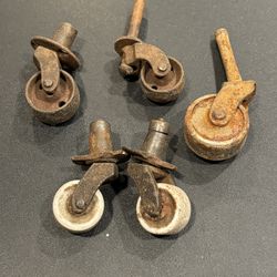 one set of vintage matching porcelain caster wheels plus 3 steel wheels. Fair condition, minor damage as shown 