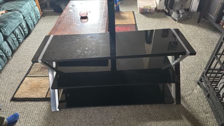 Glass top entertainment center with swivel TV stand