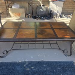 Metal tables with hammered copper squares.