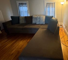 Rarely sat on Sectional sofa and throw pillows