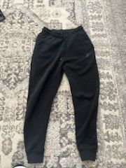 Black Nike tech pants