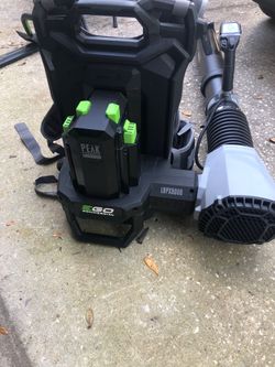 Ego battery powered 8000cfm backpack blower; HAS CHARGER BUT NO BATTERY