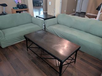 Couches w/ Green Slip Covers