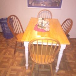 A Square Table With Four Chairs