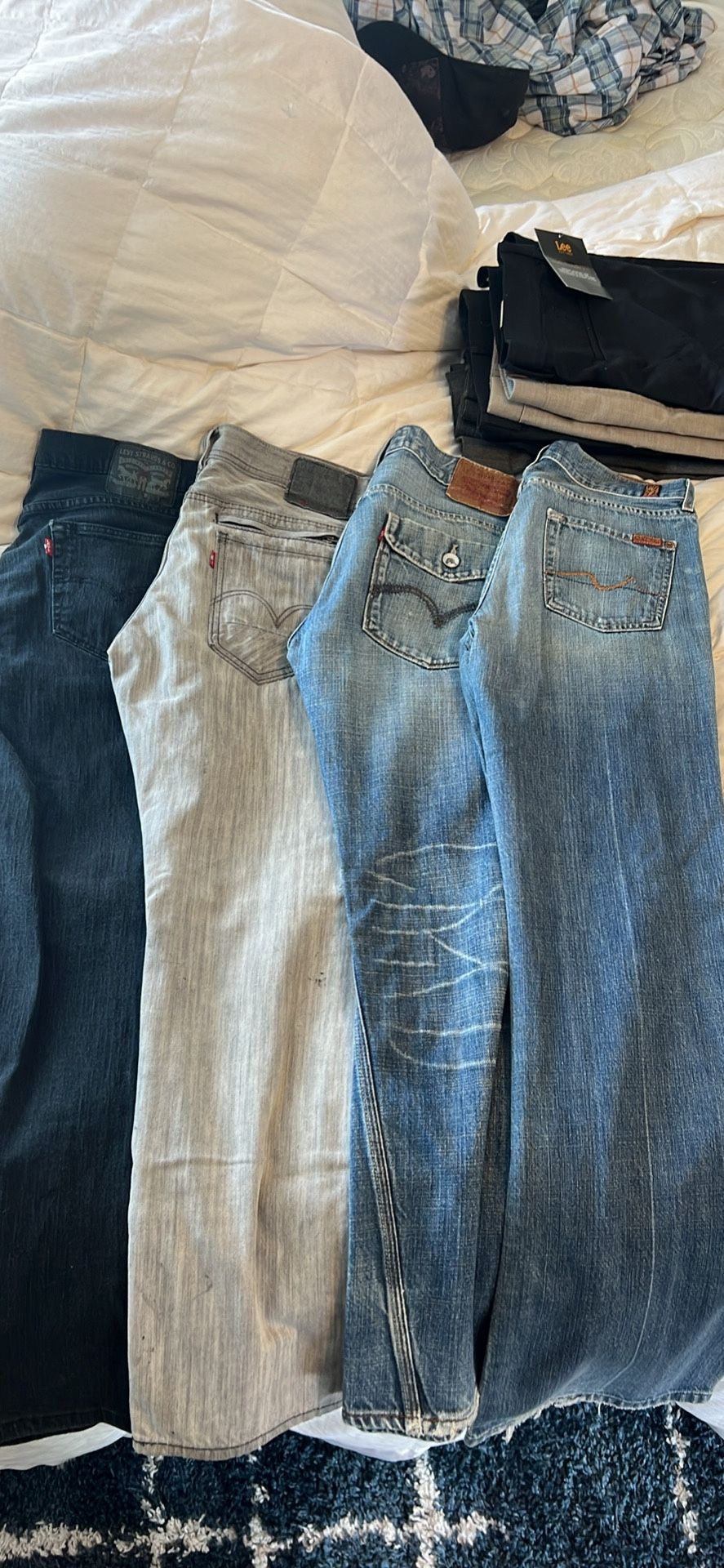 Three pairs of Levi’s one pair of Lucky sevens