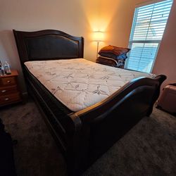 Queen size bed with mattress and frame