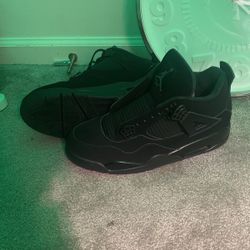 Black cat Jordan 4s