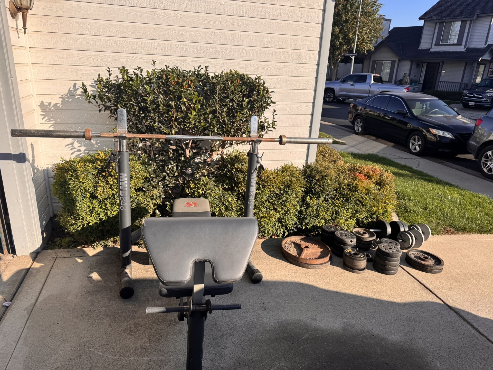 Workout Bench, Olympic Barbell, And Weight Plate Set