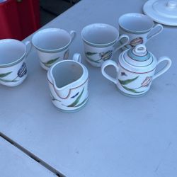 Tea Cup And Creamer And Sugar Set
