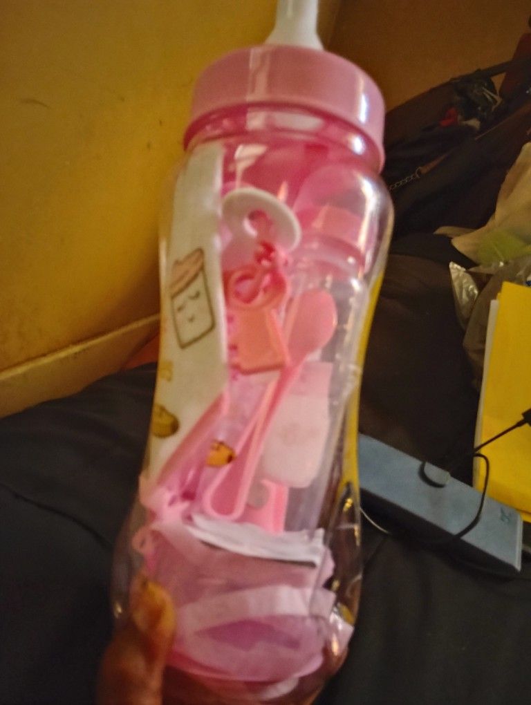 Infant bottle,bib and bank set.