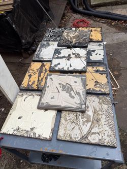 collection of antique, embossed pressed-tin ceiling tiles