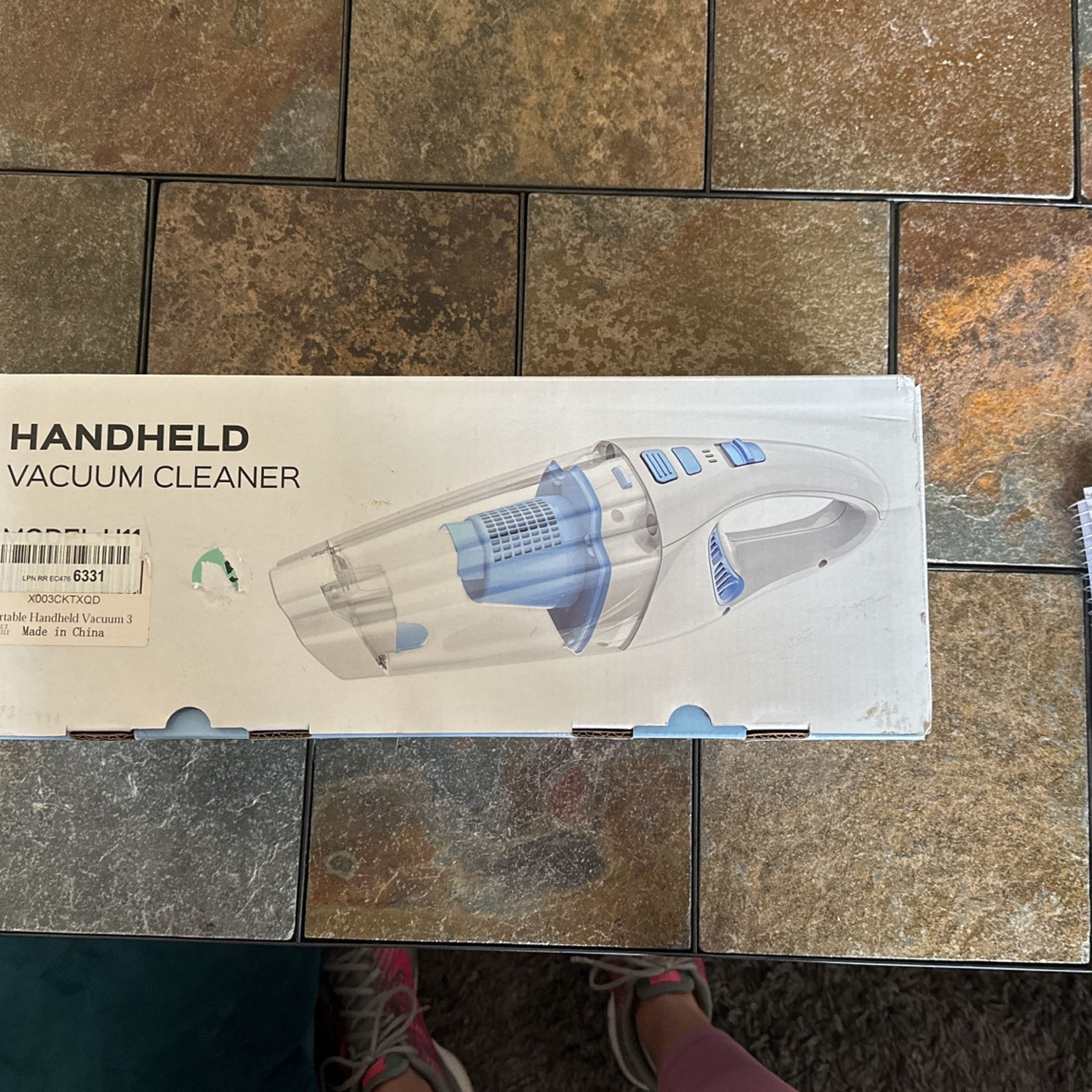 Handheld vacuum cleaner, model number H 11. Brand new in the box wrapped in plastic