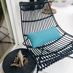 Excellent Condition Rattan Black Lounge Accent Side Living Room Patio Interior Exterior Chair Full of eye-catching curves 