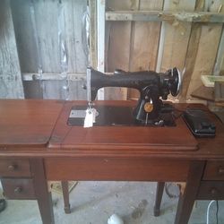 Antique Singer Sewing Machine in a Solid Oak Desk