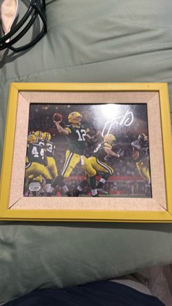Signed and authenticated Aaron Rodger’s framed picture