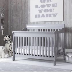 Canton deluxe 5-1 convertible crib and Newton mattress.