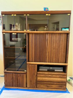 Entertainment Unit and Curio cabinet with tv hitch and drawer