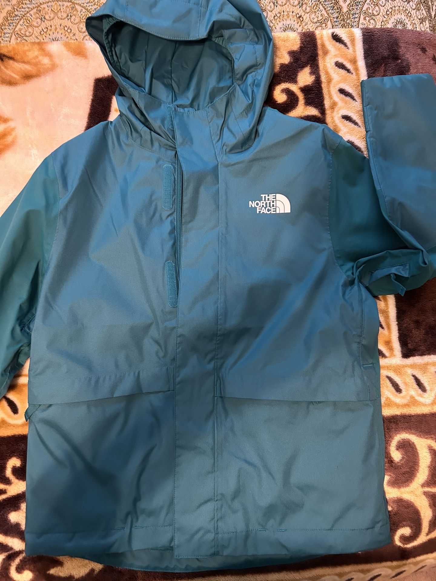 Youth Teal North face Rain Jacket.