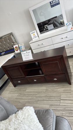 Floor model Brown TV stand only $299. Easy finance option. Same-day delivery or pick up.