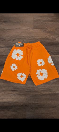 Orange denim tears shorts