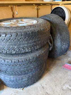 Set of 4 All-Terrain Tires on Alloy Wheels